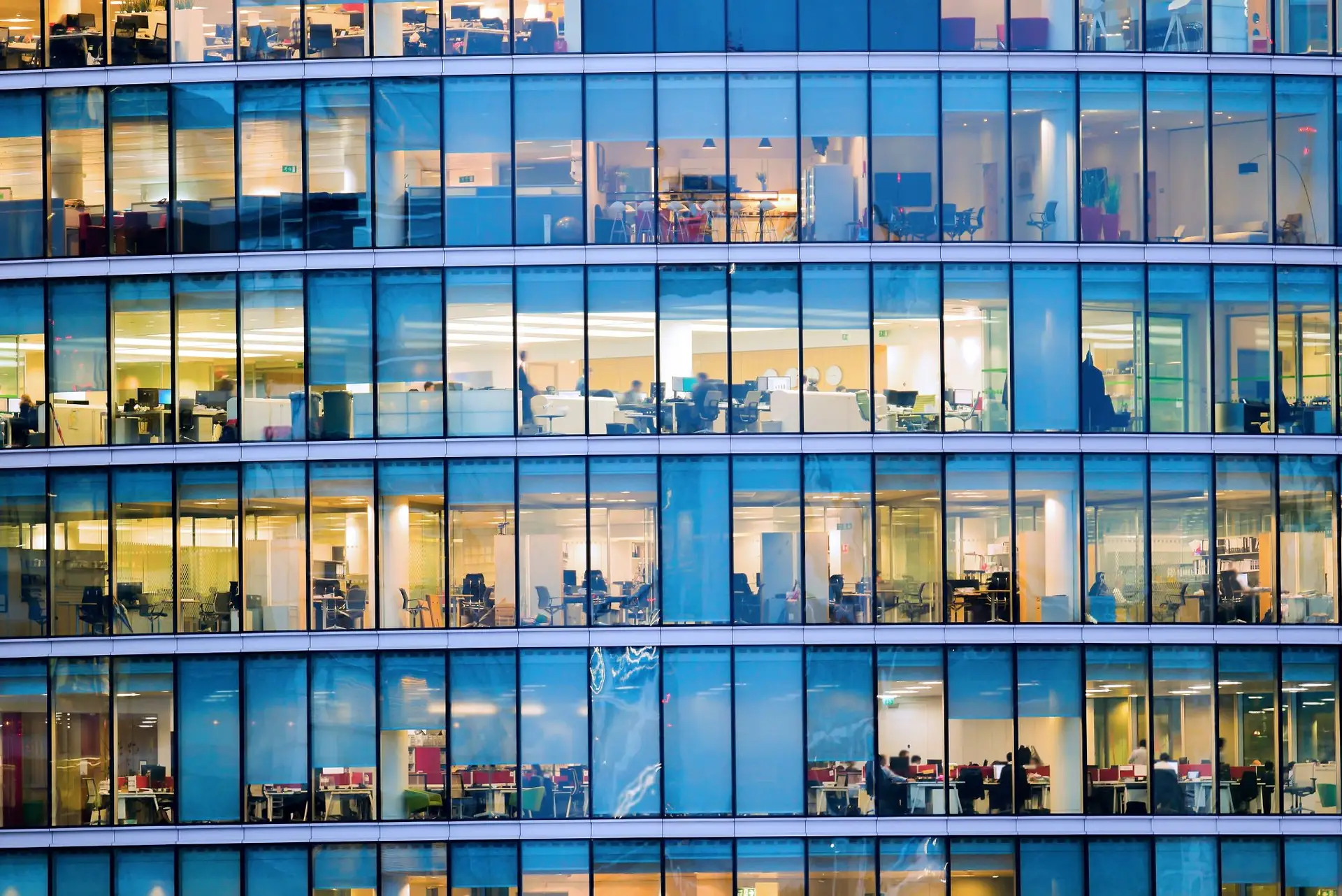 view of working offices through glass building