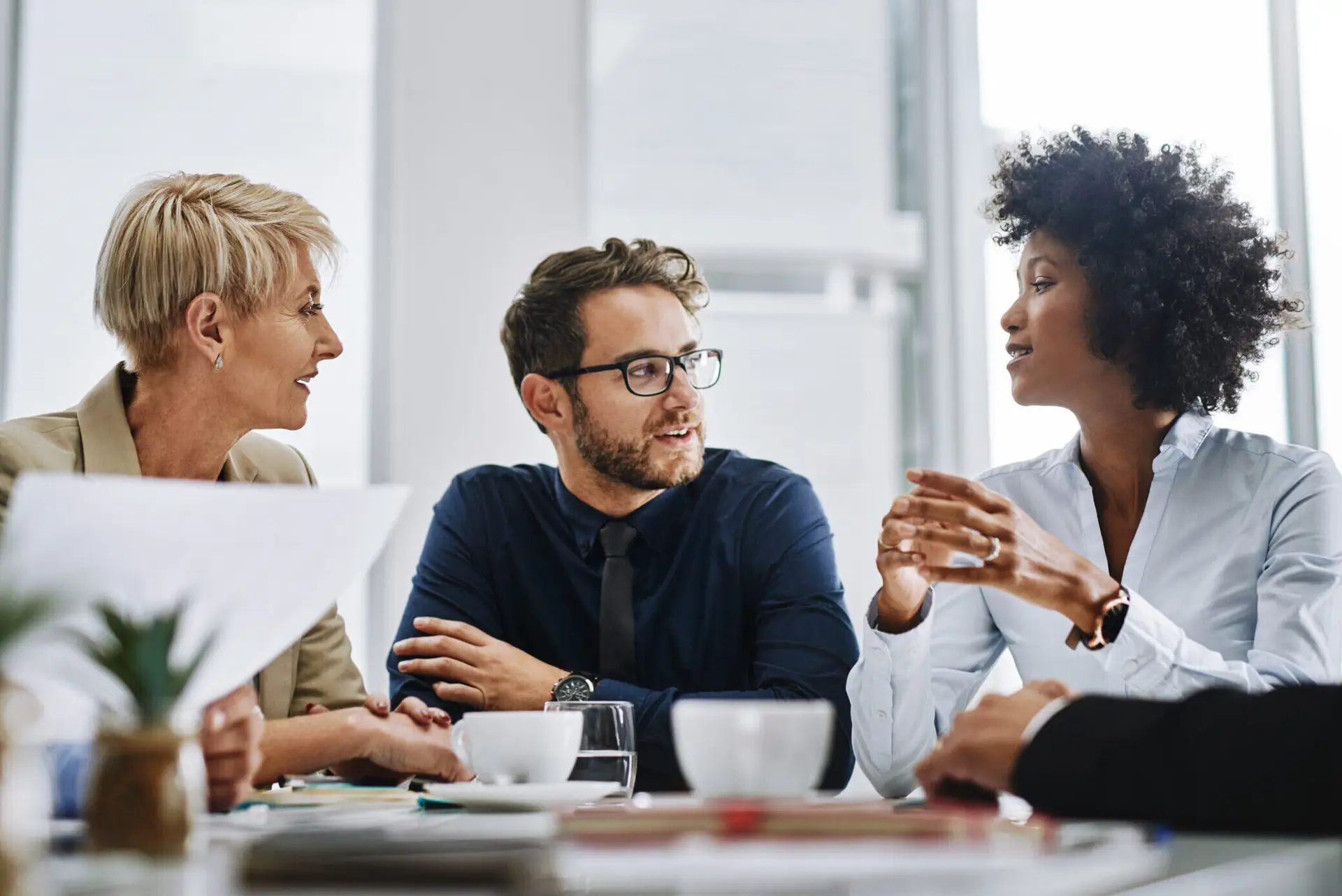 Group of businesspeople sitting together in a meeting.